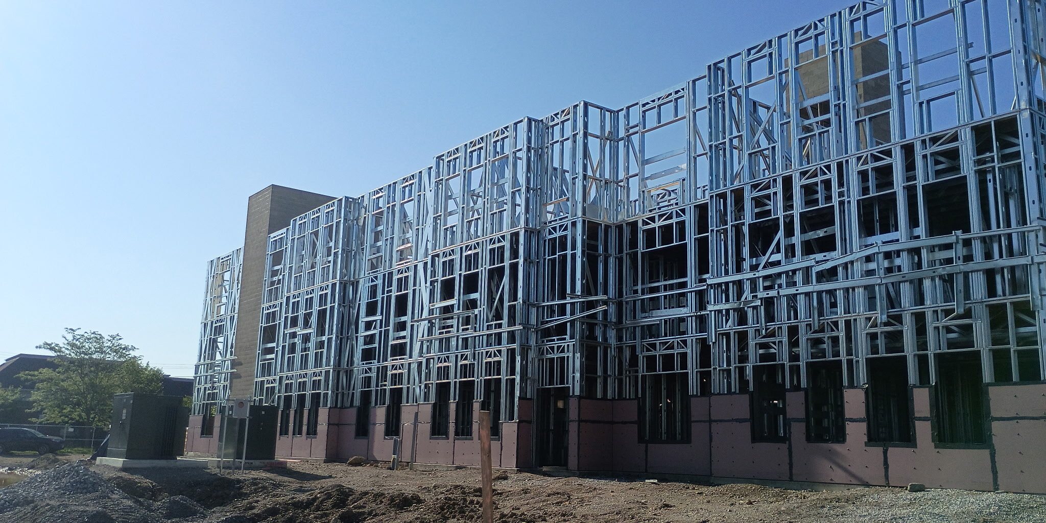 Cold-formed steel framing against the sky on an RTC project